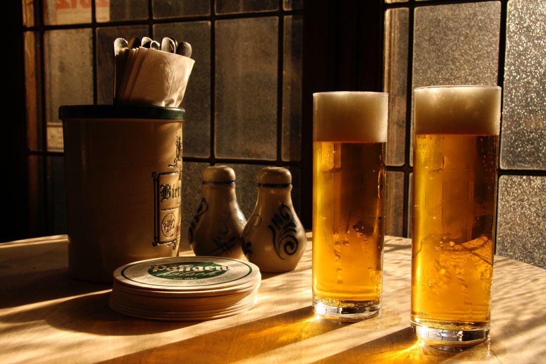 A glass of Kölsch in a traditional brewery